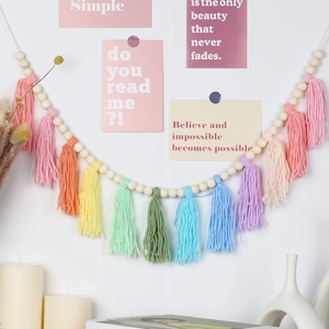 Bohemian rainbow wooden bead garland with colorful tassels for festive wall hanging decor
