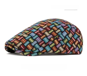 Close-up of vintage multi-color jacquard plaid beret featuring rich woven textures