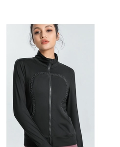 Detail of black slim-fit yoga jacket with ergonomic curved seams and stand-up collar