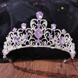 Detailed macro of a silver bridal crown with purple crystals and sparkling rhinestones