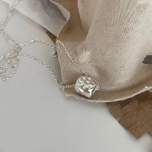 Minimalist 925 sterling silver necklace with irregular textured stone pendant