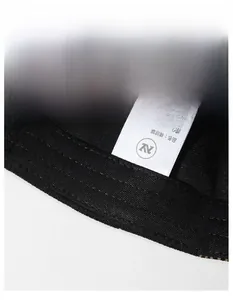 Detail view of the baseball cap interior featuring a wide sweatband and 95% polyester label