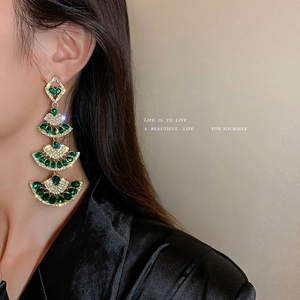 Elegant gold fan-shaped long tassel earrings with green crystals and sparkling diamonds