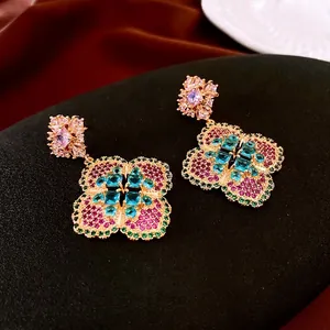 Vintage floral drop earrings with multicolored zircons on elegant black display