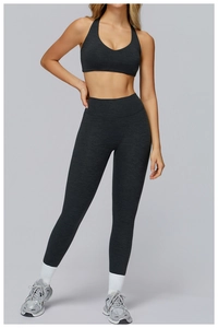Detailed close-up of dark grey high-waist yoga set with marled texture fabric for women