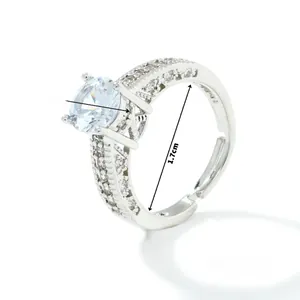 Macro view of adjustable copper ring with 0.7cm zircon center stone and side accents