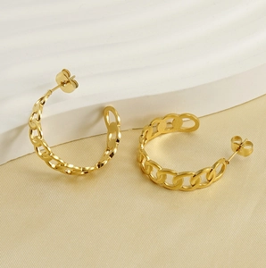 Detailed close-up of 18k gold plated stainless steel curb link chain hoop earrings