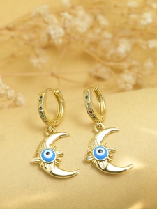 Close-up of golden moon hoop earrings with blue evil eye and colorful zircon accents