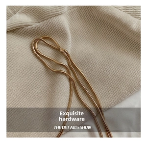 Detailed macro view of the premium gold snake bone chain hardware and metal texture