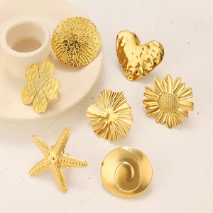 Golden stainless steel rings with embossed flower, starfish, and heart designs