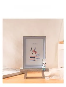 Detail of wooden 6-inch cartoon rabbit photo frame with mini stand for desk decor