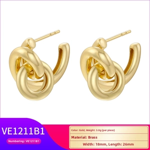 Detail view of gold knot earrings showing dimensions 18x26mm and 3.0g weight on white background
