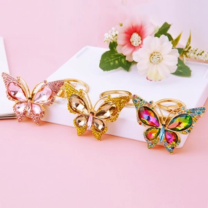 Colorful crystal butterfly keychains with sparkling rhinestones in pink and yellow hues