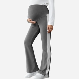 Detail of high-waist maternity flare pants with side stripes and belly support band