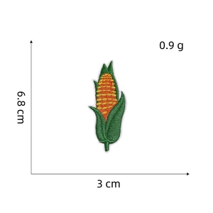 Corn shaped embroidery patch with orange and green threads measuring 6.8cm by 3cm