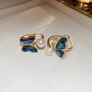 Elegant gold-plated butterfly open rings with natural pearls and shimmering zircon stones
