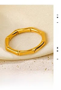 Detailed close-up of 18K gold plated stainless steel ring with bamboo joint texture