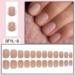 Macro detail of translucent nude press-on nails in short round-square shape style