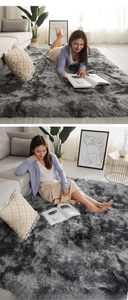 Detail of plush shaggy smokey grey rug showing soft thick pile texture in a cozy living room