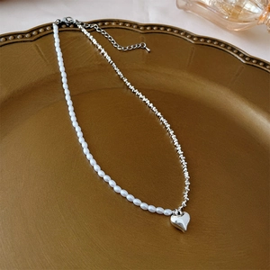 Elegant split chain necklace with white pearls, silver metal links and heart pendant
