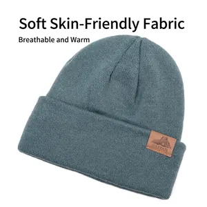 Classic knitted winter beanie in slate grey with a stylish mountain leather patch