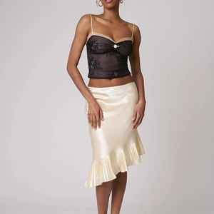 Elegant beige satin mermaid skirt paired with black lace camisole for a chic summer look