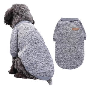 Detailed close-up of gray knit pet sweater showing thick wool texture and leather tag