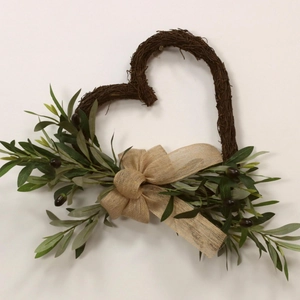 Heart-shaped olive leaf wreath with natural vine base and rustic burlap bow decor