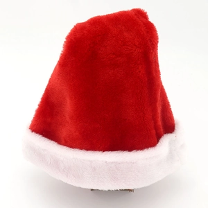 Close-up of bright red brushed fabric Christmas hat with thick white plush brim details