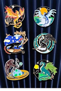 Detailed set of six dragon enamel pins featuring celestial moon and mountain themes