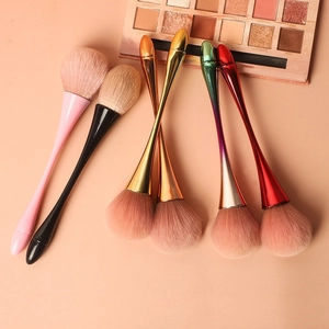 Large fluffy mushroom makeup brush set for setting powder and blush on pink background