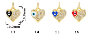 Detail view of 18K gold plated heart-shaped evil eye pendants with cubic zirconia inlay