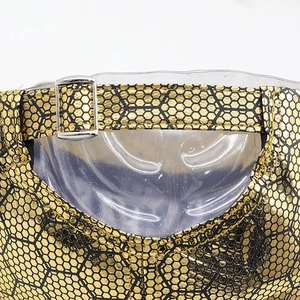 Detail of golden honeycomb texture baseball cap with adjustable metal buckle on back