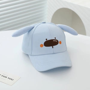 Close-up of light blue kids baseball cap with plush 3D ears and cartoon embroidery