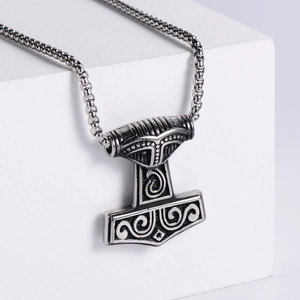 Nordic Mjolnir pendant necklace in vintage stainless steel with intricate relief patterns