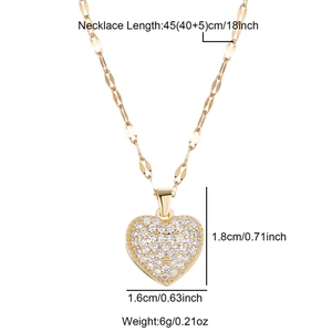 Detailed view of gold heart necklace with CZ stones and product size measurements