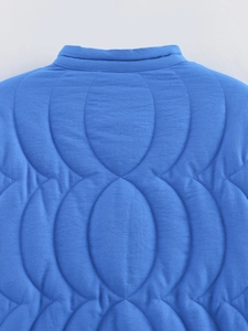 Close-up of neckline and intricate quilting on Klein blue vintage style cotton jacket