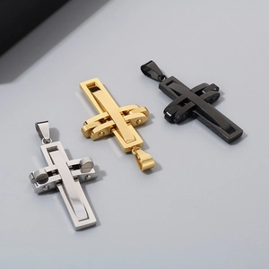 Detailed view of layered cross pendants in silver, gold, and black stainless steel