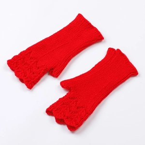 Macro shot of red knit fingerless gloves with detailed scale pattern and ribbed cuffs