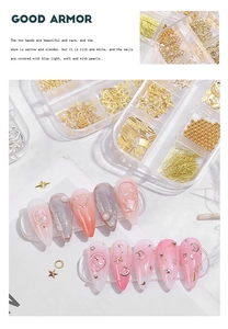 Detail of gold nail charms in 12-slot storage box with moon star heart alloy studs