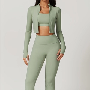 Three-piece yoga set in sage green with high-waist leggings and thumbhole jacket