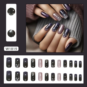 Starry night press-on nails in deep purple and silver glitter with snowflake patterns