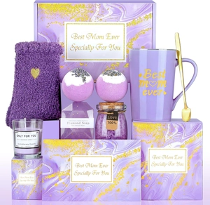 Close-up of a purple Mother's Day gift set with ceramic mug, candle, and bath accessories