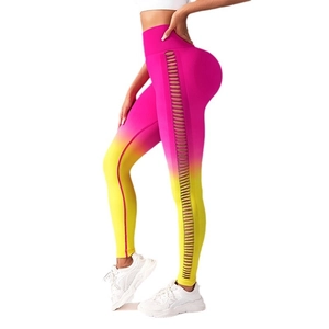 Pink and yellow gradient high waist yoga pants featuring hollow out side lace-up details