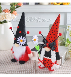 Close-up of handmade ladybug gnome plush set with polka dots and daisy details