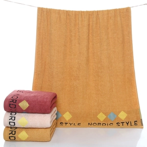 Thick cotton bath towels in Nordic style colors shown in hanging and folded view