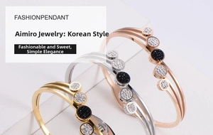 Detailed view of layered titanium steel bangles with sparkling crystals in three finishes