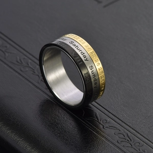Tricolor rotating calendar ring with Roman numerals on a sleek black leather background