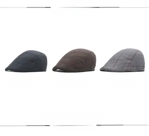 Detailed grid view of plaid flat caps in grey, brown and white textured fabric