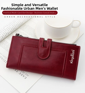 Detail of burgundy leather long wallet showing pebbled texture and multi-card slots
